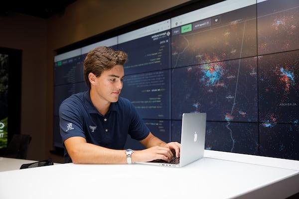 A student uses his computer in the Hewson Analytics lab