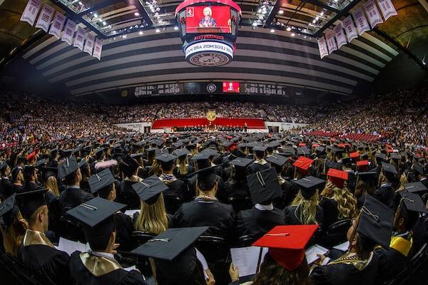 Hundreds of students watch the commencement ceremony in Coleman Coliseum