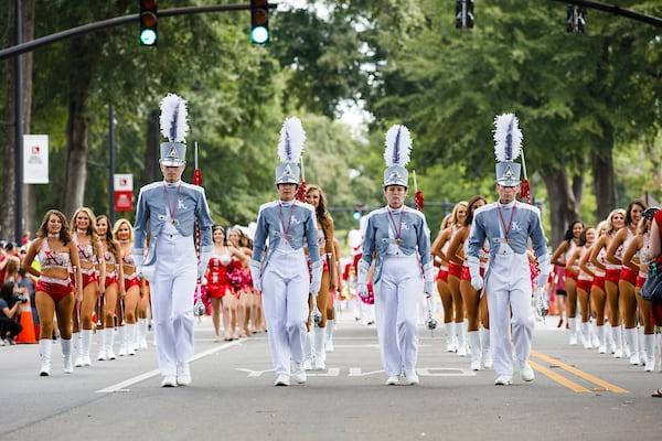 The drum majors lead the million dollar band during the homecoming parade